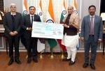 Raksha Mantri Shri Rajnath Singh receiving dividend cheque of Rs 22.50 crore for Financial Year 2022-23 from BEML Limited in New Delhi on December 29, 2023.