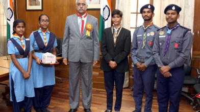 Defence Secretary presented with Flag Day sticker of Bharat Scouts